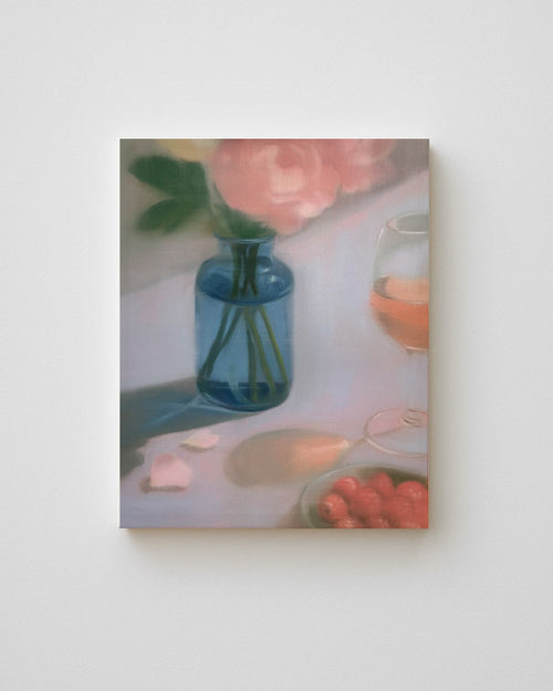 Framed artwork of a still life scene with a blue vase, flowers, and fruit on a white background.